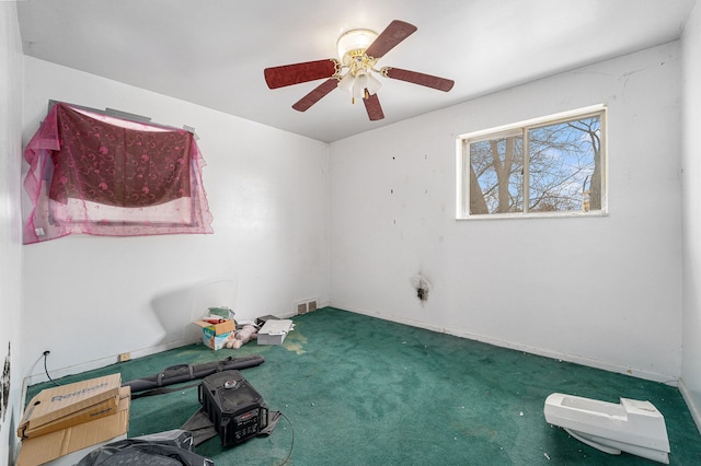 carpeted empty room with ceiling fan