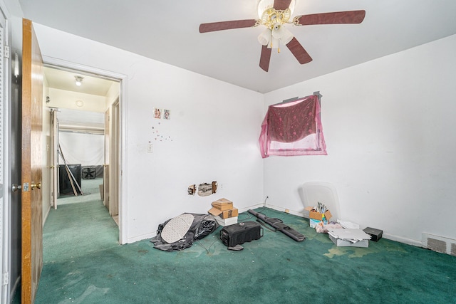 interior space featuring ceiling fan and carpet floors