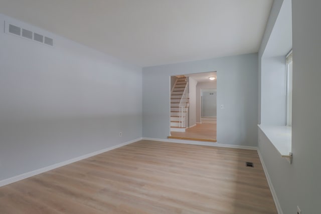 unfurnished room with light hardwood / wood-style floors