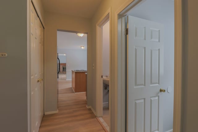 corridor featuring light hardwood / wood-style floors