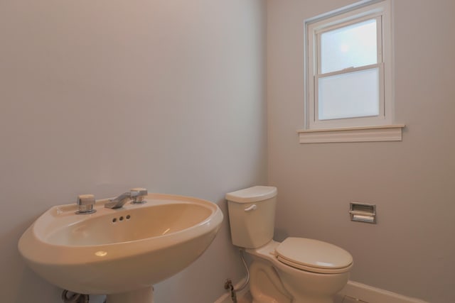 bathroom featuring toilet and sink