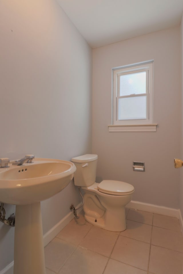 bathroom featuring tile patterned floors and toilet