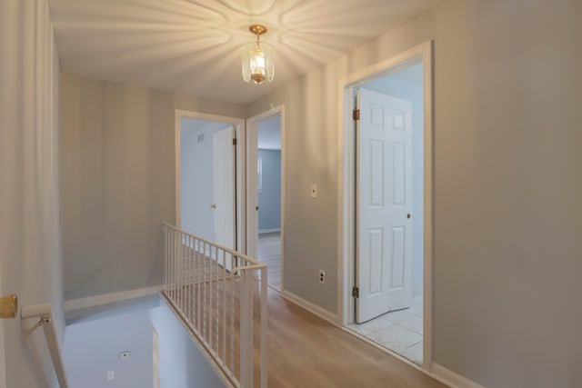 corridor featuring light hardwood / wood-style flooring