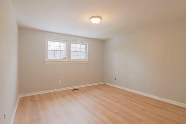 unfurnished room featuring light wood-type flooring