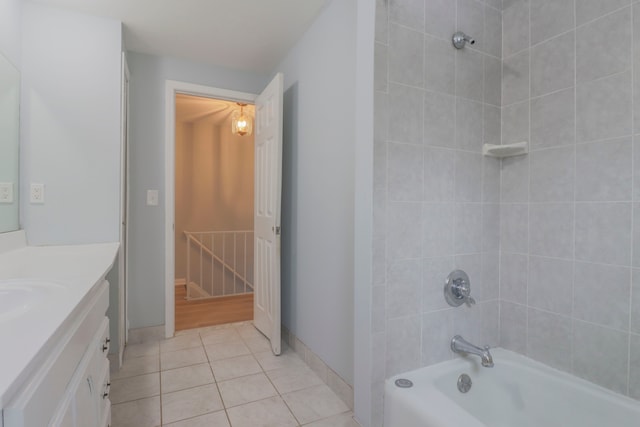 bathroom featuring vanity, tiled shower / bath combo, and tile patterned floors