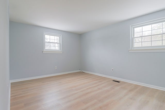 empty room with light hardwood / wood-style floors