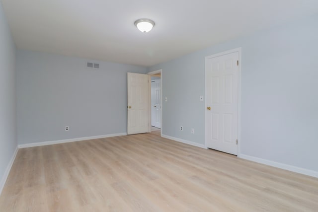 empty room with light wood-type flooring