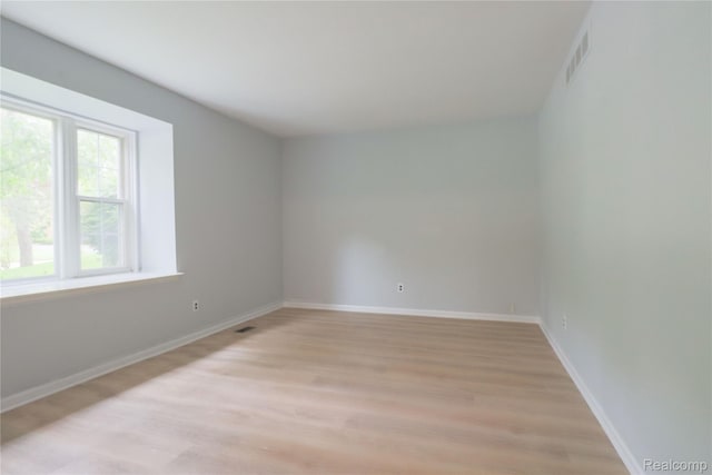 6868 Vachon Dr, Bloomfield Hills, MI 48301 - spare room with light wood-style floors and baseboards