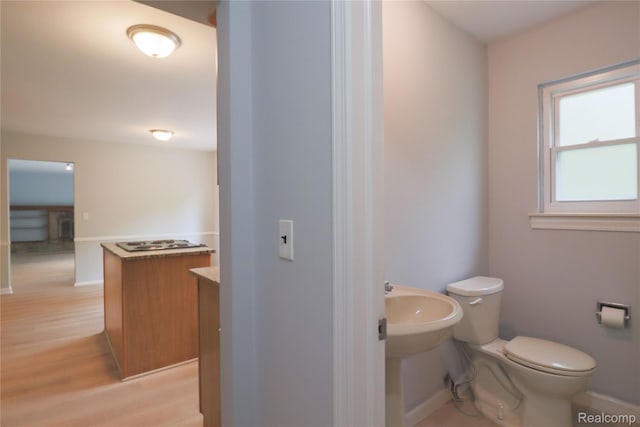 6868 Vachon Dr, Bloomfield Hills, MI 48301 - bathroom featuring baseboards, toilet, and wood finished floors