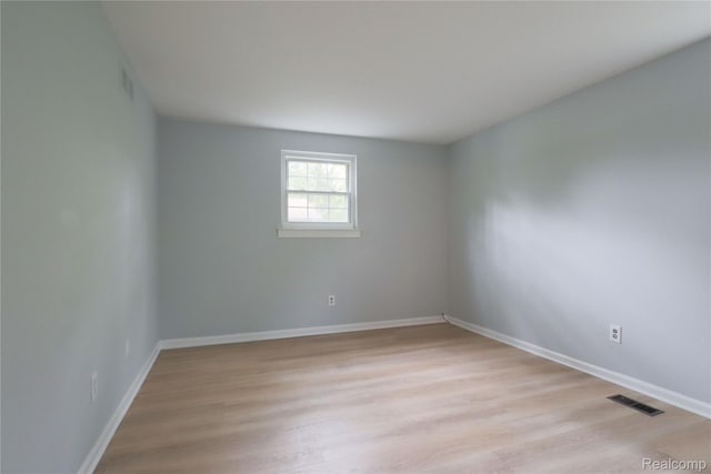 6868 Vachon Dr, Bloomfield Hills, MI 48301 - unfurnished room with light wood-type flooring and baseboards