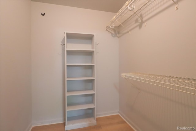 6868 Vachon Dr, Bloomfield Hills, MI 48301 - walk in closet with light wood finished floors