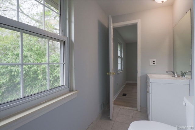 6868 Vachon Dr, Bloomfield Hills, MI 48301 - bathroom with tile patterned flooring, vanity, toilet, and baseboards