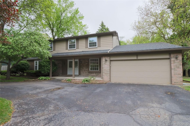 6868 Vachon Dr, Bloomfield Hills, MI 48301 - traditional-style house with brick siding, driveway, covered porch, and a garage