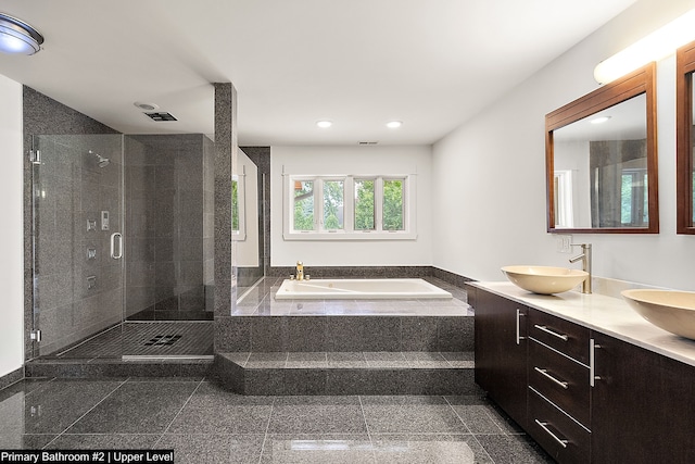 bathroom featuring vanity and separate shower and tub