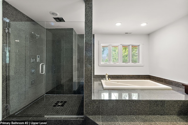 bathroom with separate shower and tub