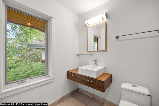 bathroom with tile patterned floors, toilet, and vanity