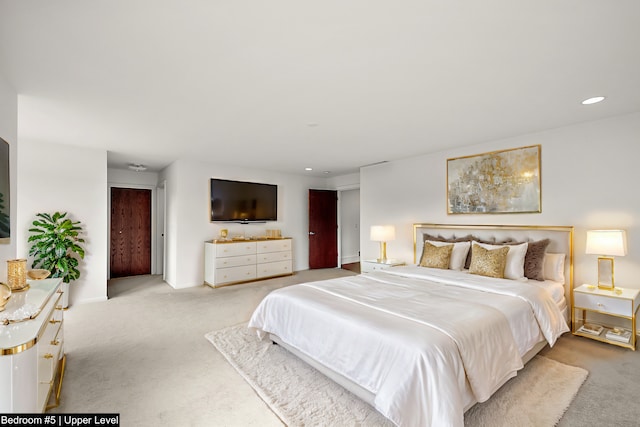 bedroom with light colored carpet