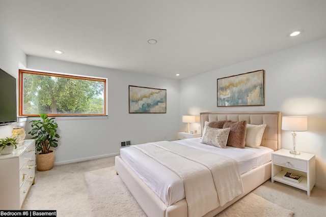 bedroom featuring light colored carpet