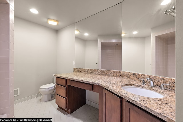 bathroom with tile patterned floors, vanity, and toilet