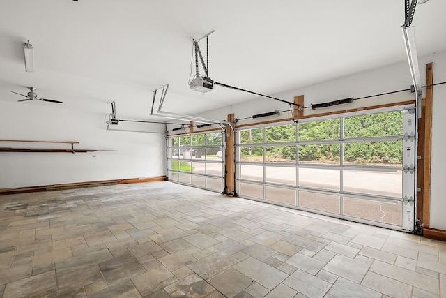 garage with ceiling fan and a garage door opener