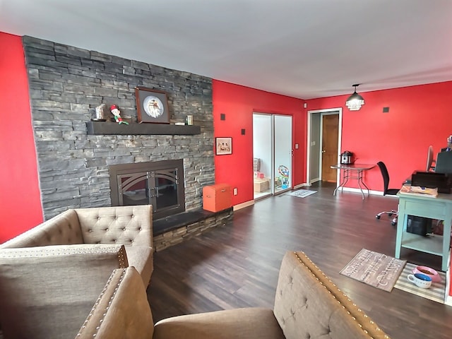 living room with dark hardwood / wood-style floors and a fireplace