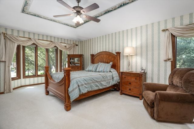 carpeted bedroom with ceiling fan