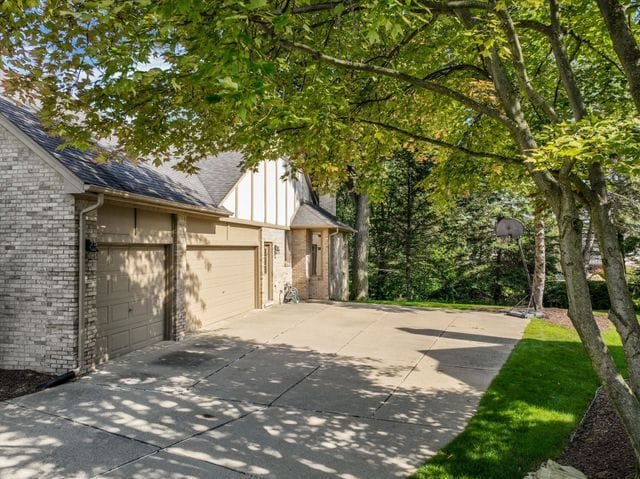 view of side of home featuring a garage