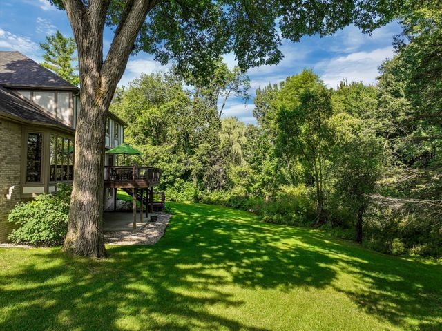 view of yard with a wooden deck