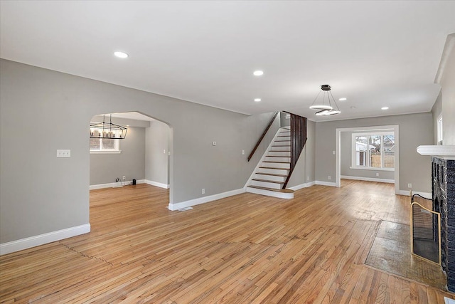 unfurnished living room featuring light hardwood / wood-style flooring