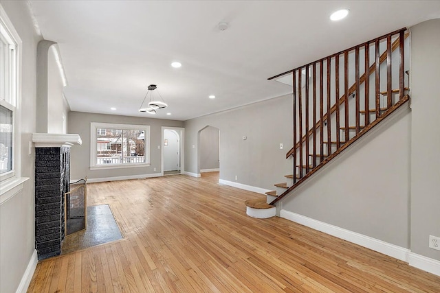 unfurnished living room with light hardwood / wood-style floors