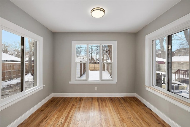 unfurnished dining area with light hardwood / wood-style floors