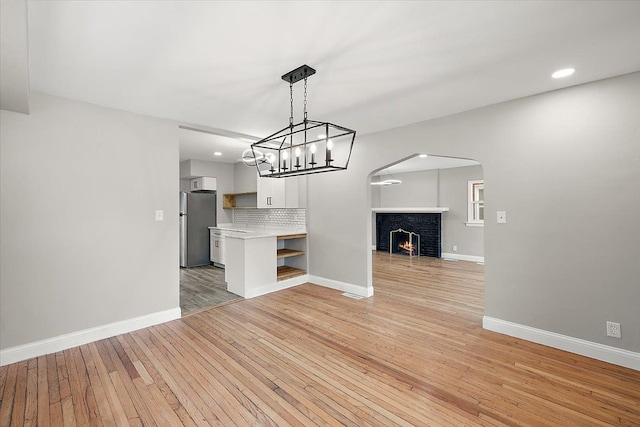 unfurnished living room featuring light hardwood / wood-style floors