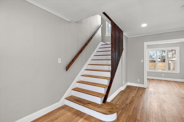 stairway featuring wood-type flooring