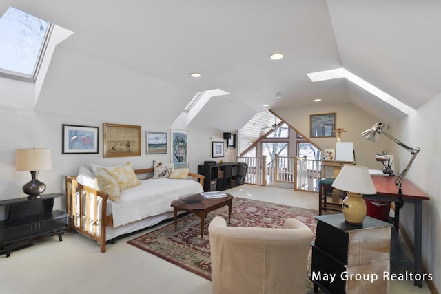 carpeted living room with lofted ceiling with skylight