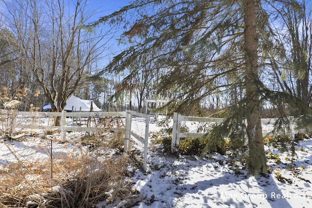 view of yard layered in snow