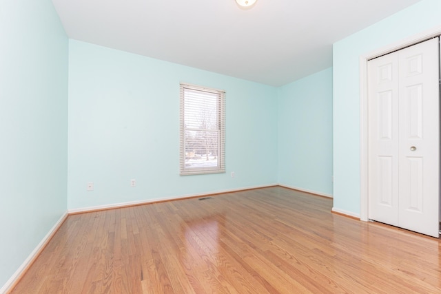 spare room featuring light hardwood / wood-style floors