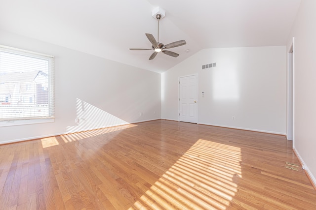 unfurnished living room featuring ceiling fan, vaulted ceiling, and light hardwood / wood-style flooring