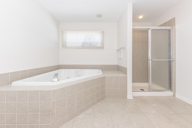 bathroom featuring tile patterned floors and shower with separate bathtub