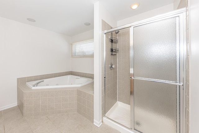 bathroom featuring plus walk in shower and tile patterned floors