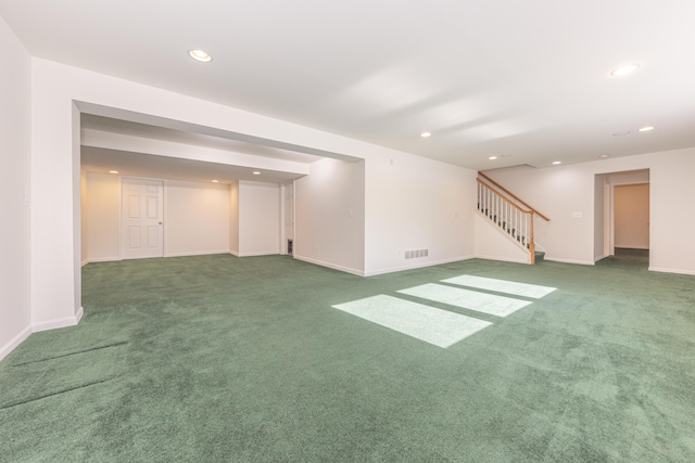 basement with dark colored carpet