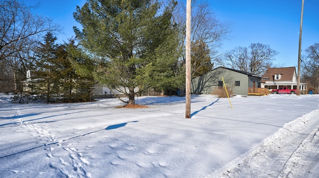 view of yard covered in snow