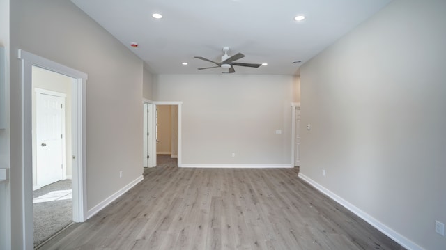 unfurnished room with ceiling fan and light hardwood / wood-style floors