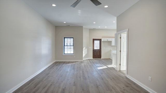 entrance foyer featuring ceiling fan and light wood-type flooring