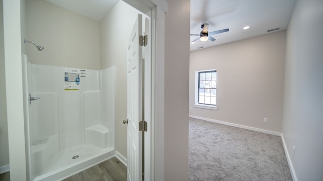 bathroom with a shower and ceiling fan