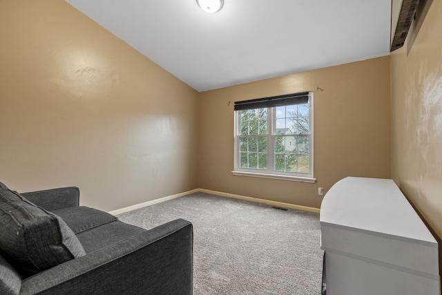 living area with vaulted ceiling and carpet floors