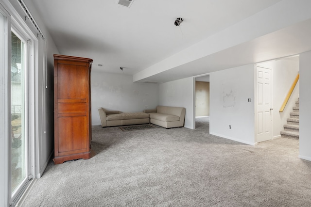 unfurnished room featuring light colored carpet