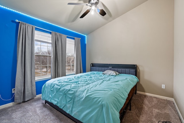 bedroom featuring vaulted ceiling, carpet floors, and ceiling fan