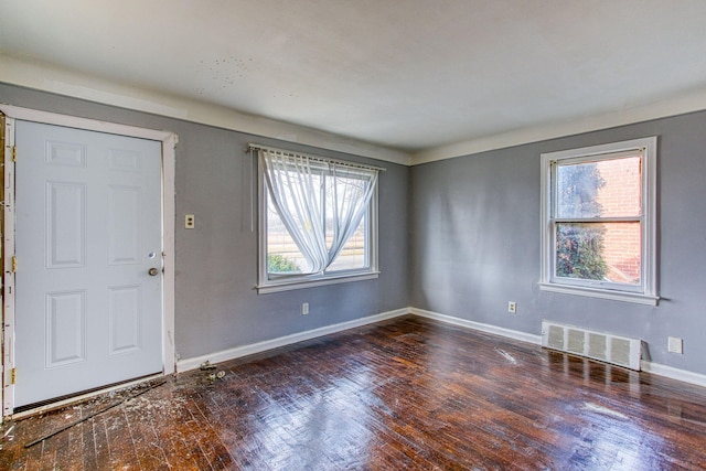 entrance foyer featuring dark hardwood / wood-style floors