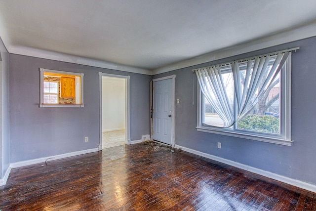 spare room with dark hardwood / wood-style floors