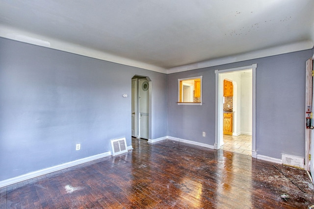 spare room with hardwood / wood-style flooring